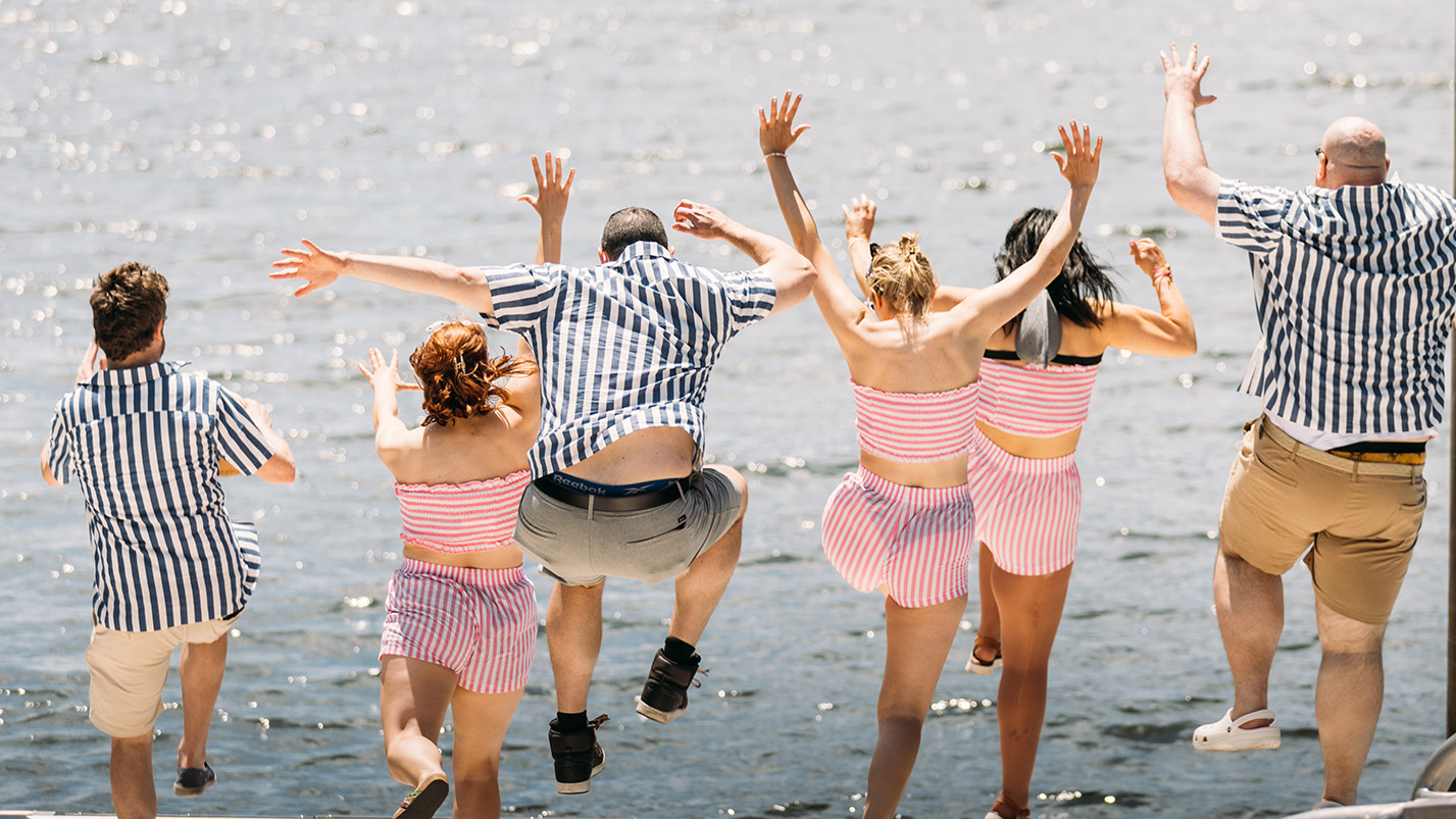 The cast of Improv Asylum jump into Boston Harbor in anticipation of the Boston Tall Ships Festival